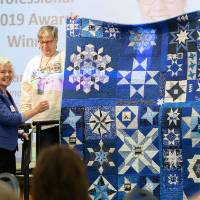 A quilt in GVSU colors was created for Marcia Haas in honor of her contributions to GVSU